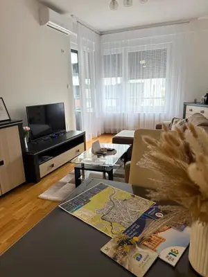 a living room with a couch and a table at Apartman Bonaca in Banja Luka