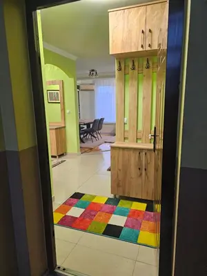 a room with a door and a colorful rug at Apartman RB, free wi-fi,klima,2 spavaće sobe in Banja Luka