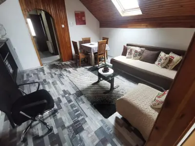 a living room with a couch and a table at Sofyy in Banja Luka