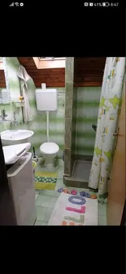 a bathroom with a toilet and a sink and a shower at Sofyy in Banja Luka