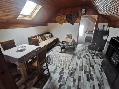 a living room with a couch and a table at Sofyy in Banja Luka
