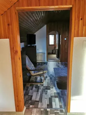 a living room with a couch and a chair at Sofyy in Banja Luka