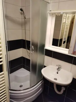a bathroom with a shower and a sink at Stan na dan Banja Luka in Banja Luka