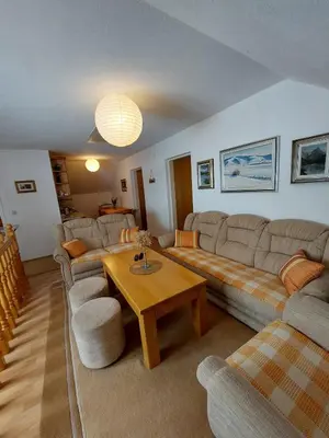 a living room with couches and a coffee table at Apartman Vidikovac in Kupres