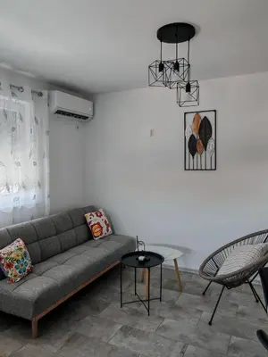 a living room with a couch and a table at Vila Nika in Banja Luka