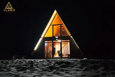 a small chapel in the snow at night at Weekend house - Vlašić in Vlasic