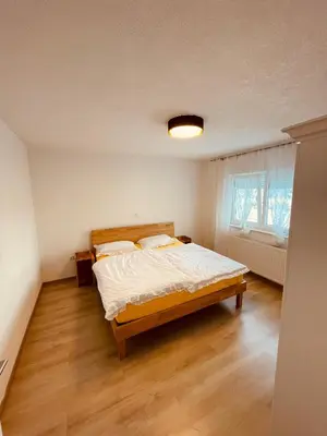 a bedroom with a large bed in a room at Apartman Vito in Kupres