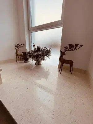 two vases sitting on a floor next to a window at Apartman Vito in Kupres