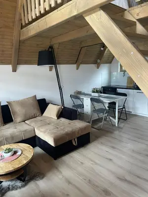 a living room with a couch and a table at Planinska kuća Marko in Vlasic