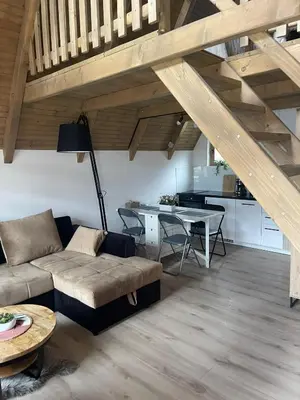 a living room with a couch and a table at Planinska kuća Marko in Vlasic
