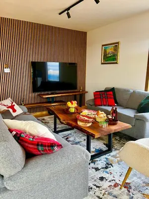 a living room with a couch and a coffee table at Villa Encian in Travnik