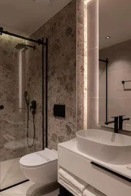 a bathroom with a tub and a toilet and a sink at Garni Hotel Galeria in Banja Luka