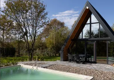 an external view of a house with a pool at Wellness Borealis in Tuzla