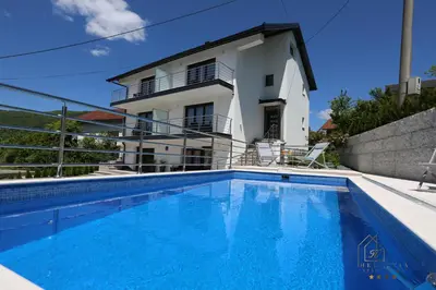 a view of the villa from the swimming pool at Helvetia Apartments in Jajce