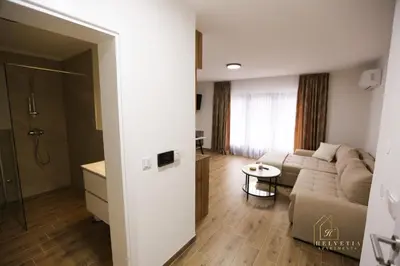 a living room with a couch and a table at Helvetia Apartments in Jajce