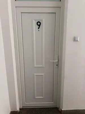 a white door with the number seven on it at Apartman The Bo in Prnjavor