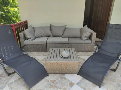 a living room with a couch and two chairs at Šumska Oaza in Laktaši