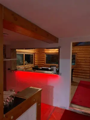 a kitchen with a red bar in a house at Dragon's Lodge in Visoko