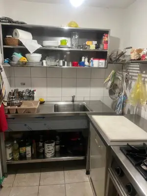 a kitchen with a sink and a counter at Dragon's Lodge in Visoko