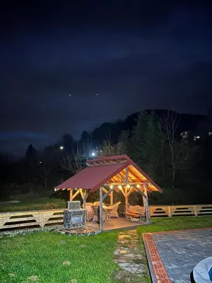 a gazebo in a park at night at Dragon's Lodge in Visoko