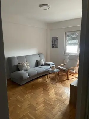 a living room with a couch and a table at Evergrey in Banja Luka