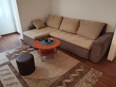 a living room with a couch and a table at Apartman Anja in Banja Luka