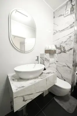 a bathroom with a sink and a mirror at Central Point Apartmani, Banja Luka in Banja Luka
