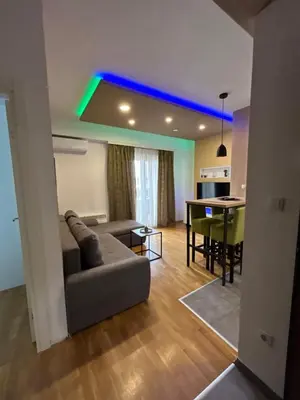 a living room with a couch and a table at Apartmani Kastel 3 in Banja Luka