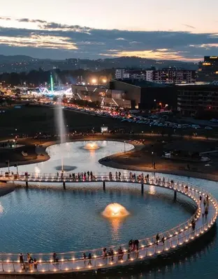 a large circle of lights in the water at night at Apartmani Kastel 4 in Hiseti