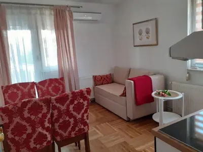 a living room with a couch and a chair at Komforni Apartmani Banja Luka in Banja Luka