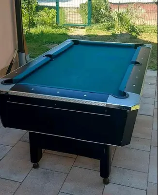 a pool table sitting on top of a patio at Holiday home Alexa in Banja Luka