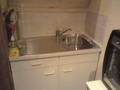 a kitchen sink with a faucet on top of it at Endzi VS Vlašić in Travnik