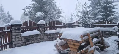 a fence covered in snow in a yard at Endzi VS Vlašić in Travnik