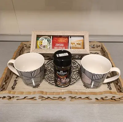 a tray with two cups and a tray with coffee cups at Apartman Bulevar Živinice in Živinice