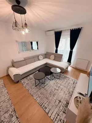 a living room with a couch and a table at Apartment Saturday in Travnik