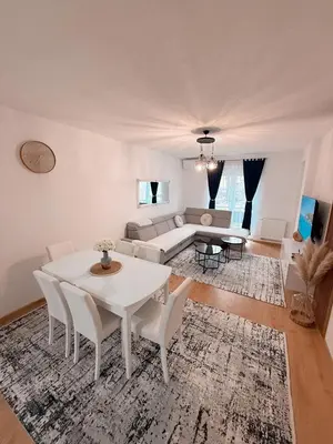 a living room with a white table and chairs at Apartment Saturday in Travnik