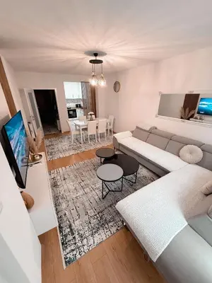 a living room with a couch and a table at Apartment Saturday in Travnik