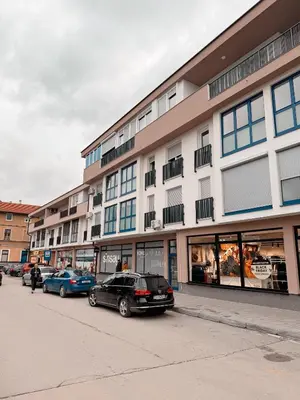 a row of cars parked in front of a building at Apartment Saturday in Travnik