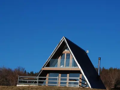 a frame house with a gambrel roof at Mountain house Tomislavgrad in Tomislavgrad