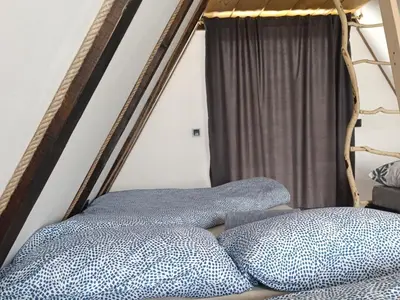 a bed with two pillows in a room at Mountain house Tomislavgrad in Tomislavgrad