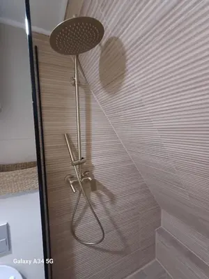 a shower in a bathroom with a shower head at Mountain house Tomislavgrad in Tomislavgrad