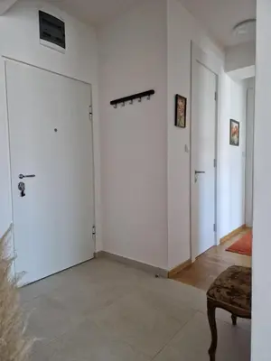 a room with white walls and a door at Apartmani Stan na dan 34 in Banja Luka