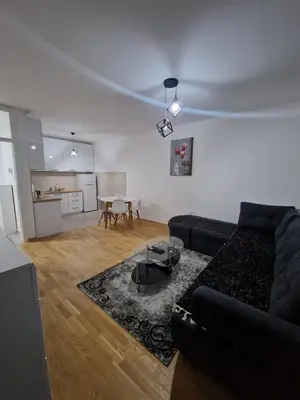a living room with a couch and a table at Apartmani Stan na dan 34 in Banja Luka