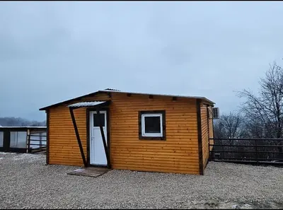 a small wooden building with a door on top at blanca 6 in Nova Bila