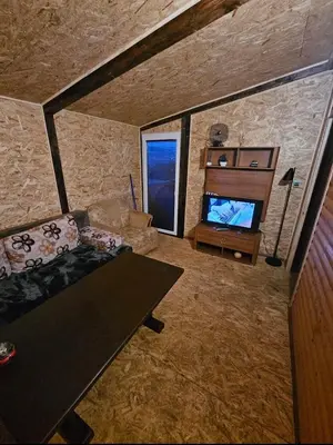 an overhead view of a living room with a couch and a television at blanca 6 in Nova Bila