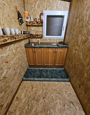 a bathroom with a sink and a microwave at blanca 6 in Nova Bila