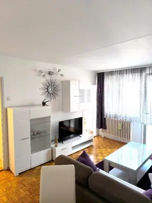 a living room with a couch and a table at Apartment Sneki Banja Luka in Banja Luka