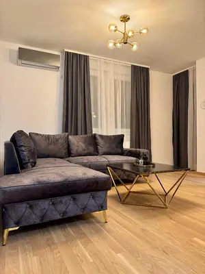 a living room with a couch and a table at Apartman Dublin in Banja Luka