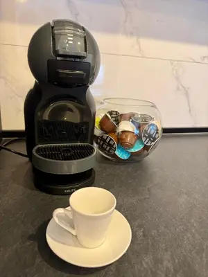 a coffee maker and a cup on a counter at Apartman Dublin in Banja Luka