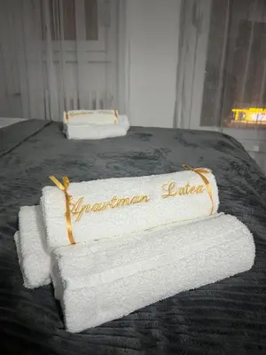 two towels on a bed in a room at Apartman Latea in Banja Luka